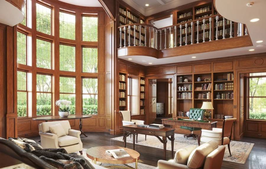 A wood-paneled library office with floor-to-ceiling bookshelves, tall windows, and an executive desk with a green leather chair